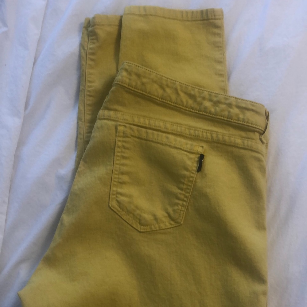 Yellow North Face skinny Jeans